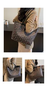 Dettaglio della borsa tote grande in PU stampato con motivi floreali e spalline sottili