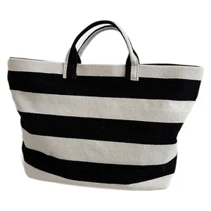 Minimalist black and white striped canvas tote bag with large capacity for travel