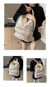 Detail of champagne gold quilted space cotton backpack with metallic zippers and thick handle