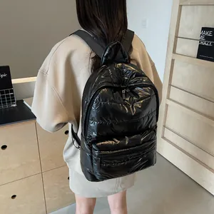 Glossy black quilted padded backpack for women featuring lightweight space cotton material