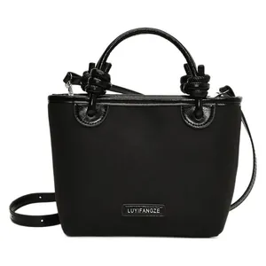 Schwarze Retro-Eimertasche mit großem Knotengriff und schmalem Schulterriemen