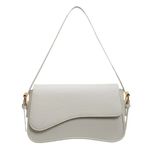 Retro white litchi grain leather shoulder bag with unique wavy curved flap and gold hardware