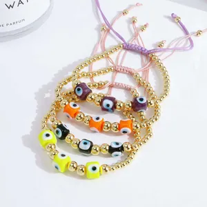 Set of four 18K gold-plated Evil Eye beaded bracelets with adjustable braided cords