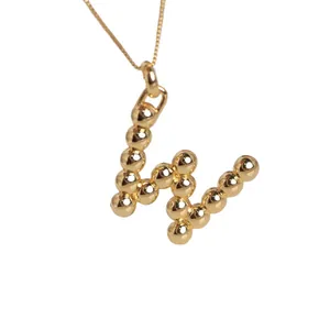 18K gold plated necklace with 3D bubble balloon letter w pendant on white background
