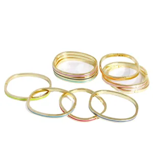 Stack of 18K gold plated hinged bangles featuring colorful handmade enamel stripes