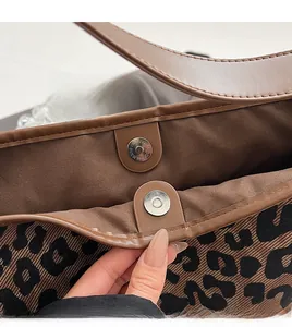Close-up of leopard tote bag interior with high-quality magnetic metal buckle and fabric