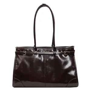 Large dark brown oil wax leather tote bag with glossy finish and silver buckles