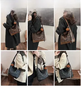 Detail view of leopard print tote bags with bear charms and patterned tassels in six angles