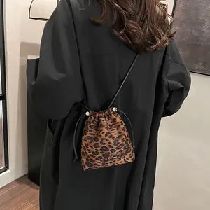 Fashionable leopard print drawstring bucket bag with silver metal logo for women
