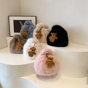 Fuzzy plush cloud tote bags in six colors with teddy bear charms on display