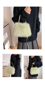 Detail of light green faux fur handbag featuring soft plush texture and leather straps