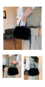 Close-up of black faux fur handbag with golden hardware and slender shoulder strap