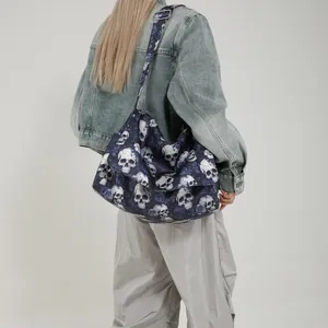 Large nylon tote bag with skull and blue rose print featuring adjustable wide strap