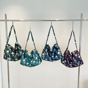 Large nylon tote bags with skull and rose patterns in four colors and adjustable straps