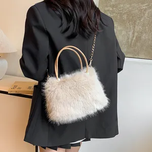Plush faux fur handbag in beige with pearl accents and gold chain strap for women