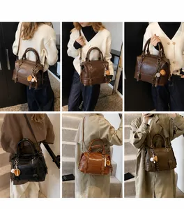 Model draagt de vintage Boston-tas van oliewasleer in meerdere kleuren en draagstijlen