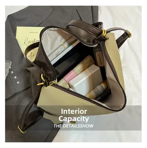 Internal capacity detail of denim backpack with zippers and organized storage space