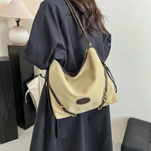 Chic beige large capacity tote bag with brown trim and vintage gold hardware accents