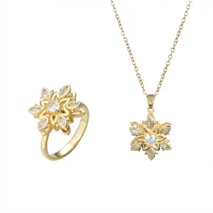 Goldenes rotierendes Schneeflocken-Schmuckset mit Halskette und Ring mit Zirkonia-Inlay