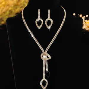 Elegant gold necklace and teardrop earring set with black crystals for bridal evening wear