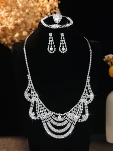 Detail shot of shimmering bridal jewelry set with crystal necklace and earrings