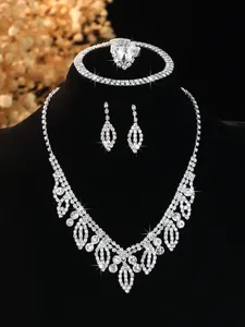 Detailed view of rhinestone jewelry set with leaf necklace and heart shaped ring