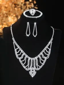 Detailed view of silver rhinestones bridal necklace, earrings, bracelet and ring set