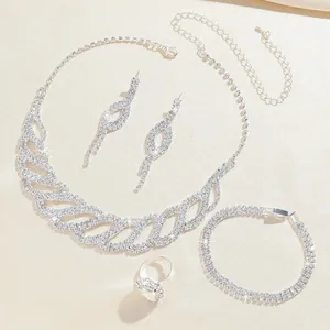 Elegant silver bridal jewelry set with sparkling rhinestones including necklace and earrings