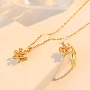 Elegant gold titanium steel spinning zircon flower necklace and ring set for women