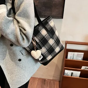 Contrast plaid tote bag in woolen fabric with black leather straps and plush heart charm