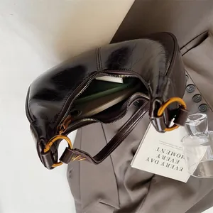Retro coffee brown oil wax leather hobo bag with gold metal rings and zipper closure