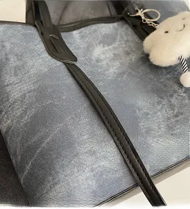 Macro shot of durable denim fabric texture and neat stitching on casual tote bag detail