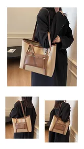 Detail der Kontrastnähte und der abnehmbaren Mini-Reißverschlusstasche am beigen Shopper