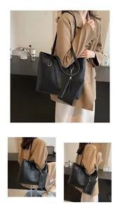 Detailansicht des schwarzen Shopper-Sets mit großer Umhängetasche und passender Reißverschlusstasche