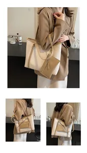 Detail des zweiteiligen Shopper-Sets mit cremefarbenem Leder und khakifarbener Tasche