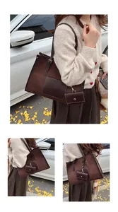 Detail of dark brown suede tote bag with leather pocket and matching small coin purse pouch