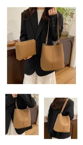 Detail of brown lychee texture bucket bag and matching pouch for women in daily style