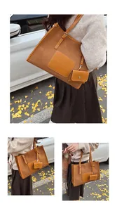 Close-up of brown suede tote bag with matching mini coin purse and leather straps