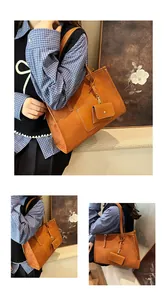 Detail view of large caramel suede tote bag with matching mini pouch and double handles