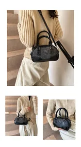 Three-way view of a grey wool and black leather mini bowling bag with COIH logo