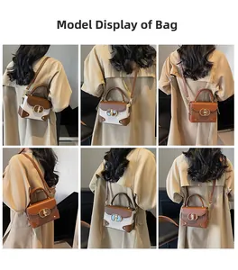 Model showing a vintage-style box handbag with brown leather trim and a metal clasp