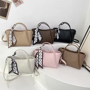 Fashionable minimalist bucket bags in multiple colors with heart print silk scarf details