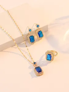 Détails d'un ensemble de bijoux en zircon bleu saphir avec collier et boucles d'oreilles