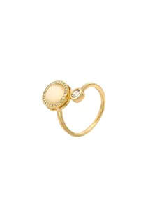 Macro detail of gold-plated open ring with spinning cat eye stone and zircon accents