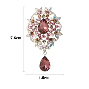 Vintage silver flower brooch with pink pear-cut crystals and dangling gemstone drop