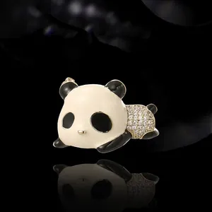 Sparkling panda brooch with rhinestones and enamel finish on elegant black mirror background