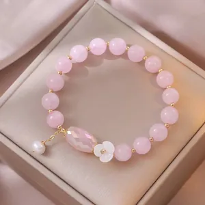 Elegante bracciale di perle di cristallo rosa con perla d'acqua dolce e ciondolo fiore