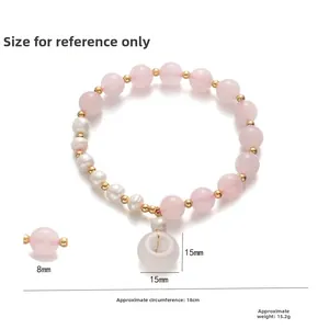 Bracciale in quarzo rosa e perle d'acqua dolce con ciondolo a ciambella bianca e oro