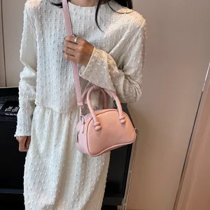 Pink trendy small square handbag and crossbody bag for women with elegant ball handle detail