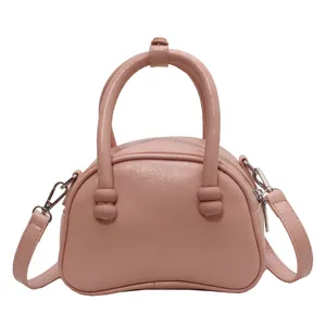 Pink minimalist Boston handbag with top handle and detachable strap for daily commuting